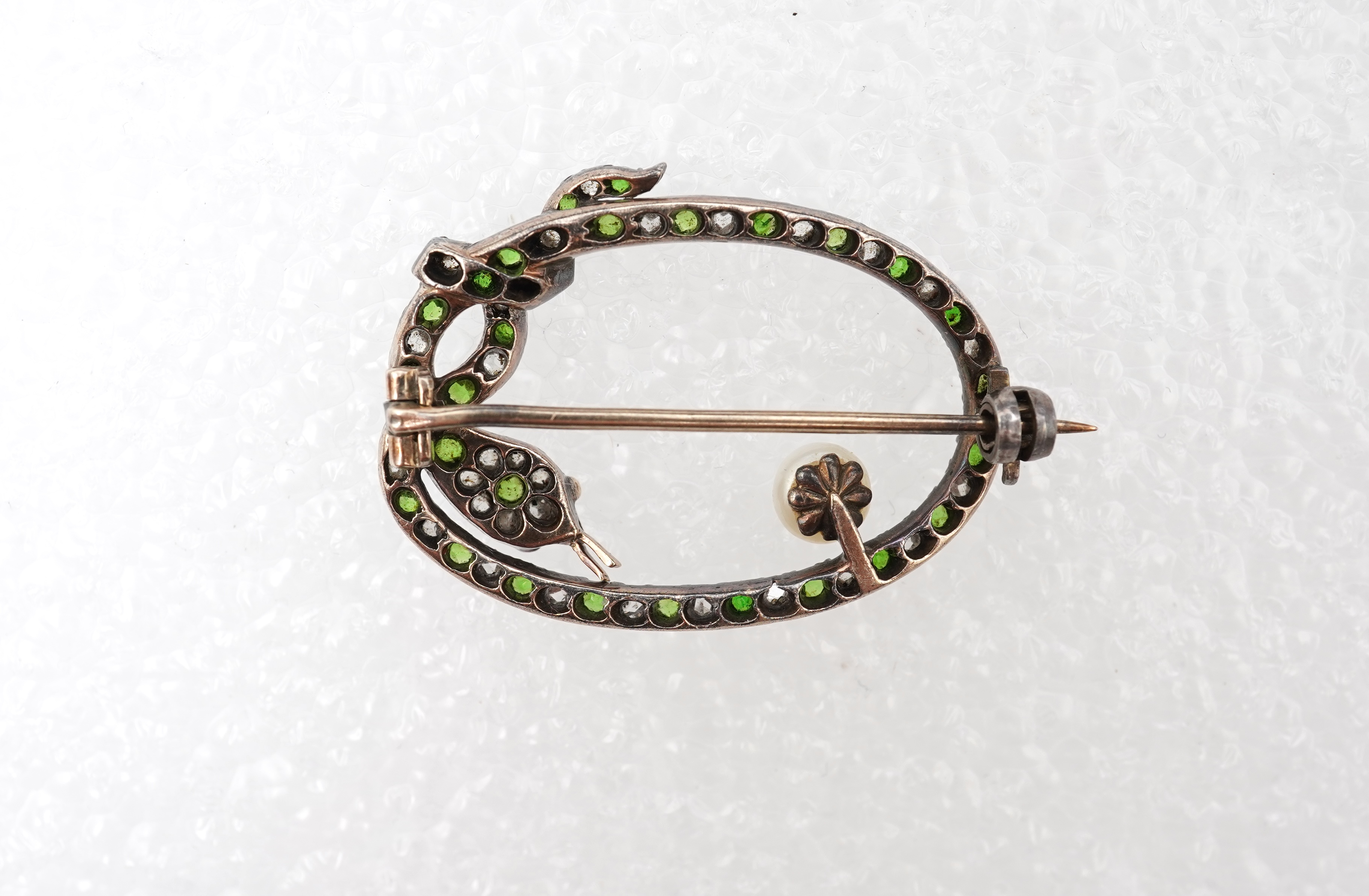 A Victorian demantoid garnet, pearl and diamond brooch, late 19th century